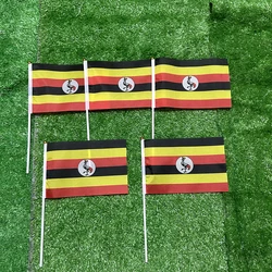 Bandera de Uganda mano en poliéster con asta plástica