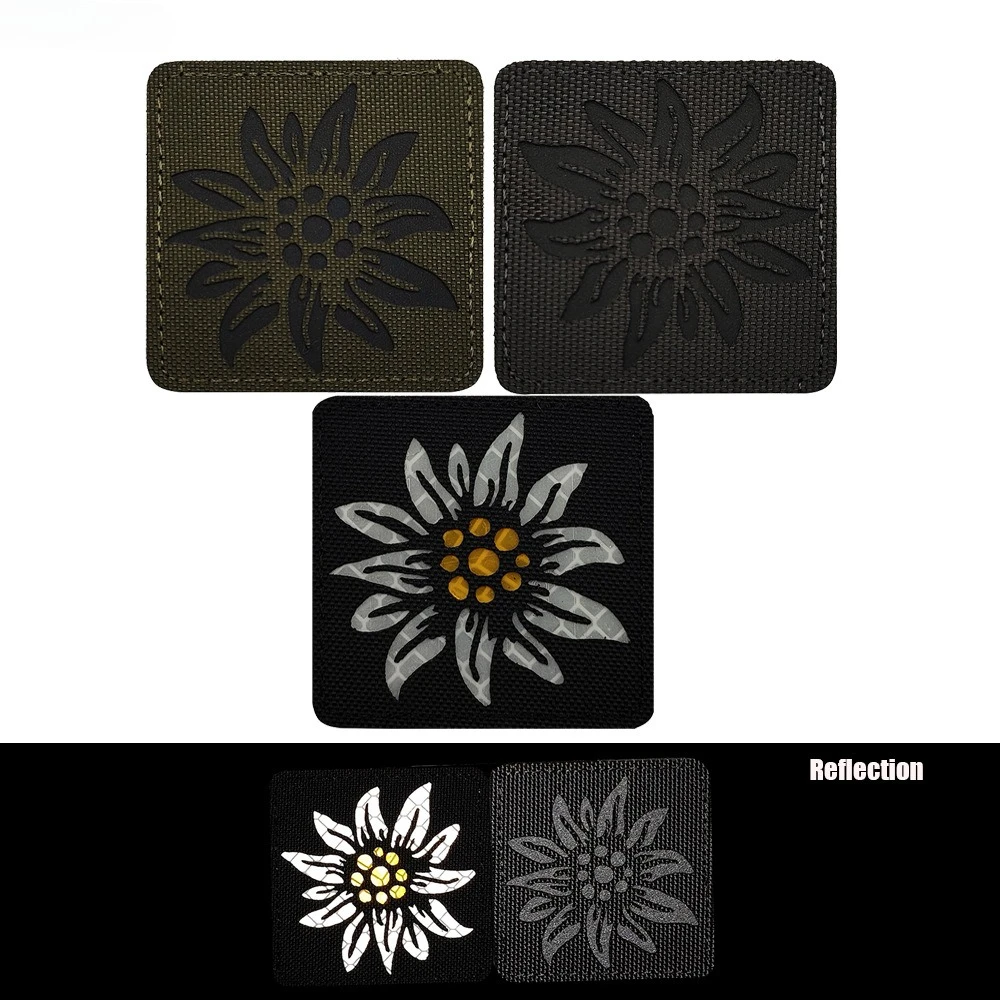 Insignia Edelweiss reflectante con gancho y bucle