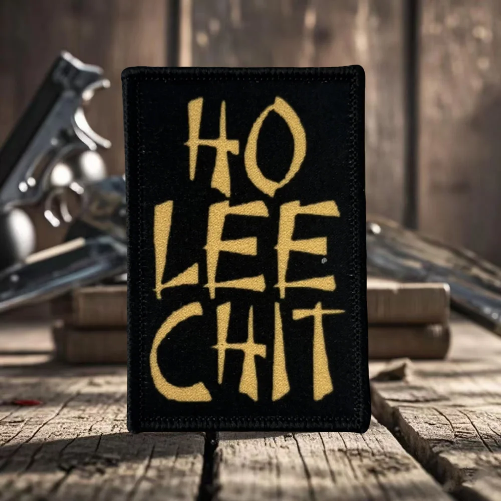 Parche táctico HO LEE CHIT en fondo oscuro