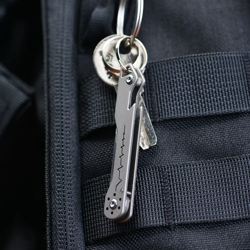 Cuchillo de bolsillo EDC plegable titanio con llavero - imagen 5