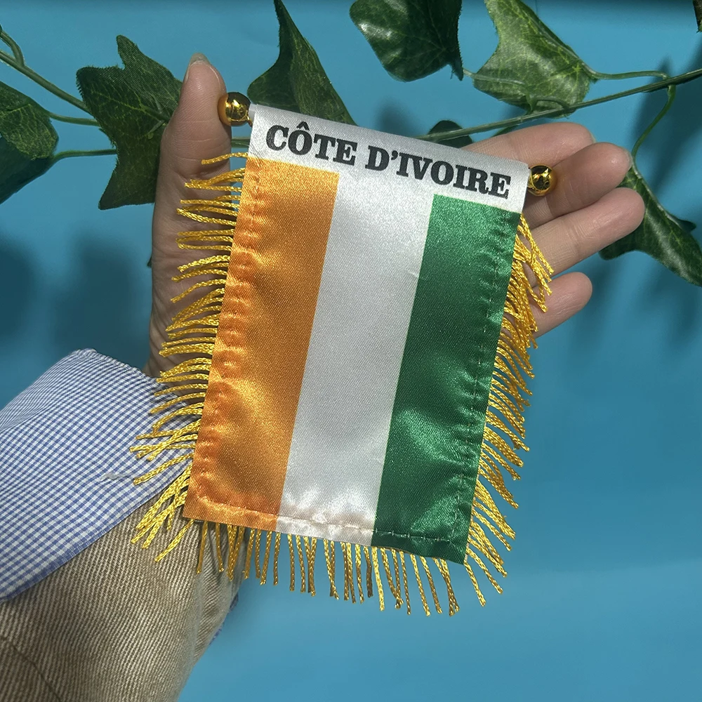 Detalle del diseño de la bandera de Costa de Marfil en poliéster