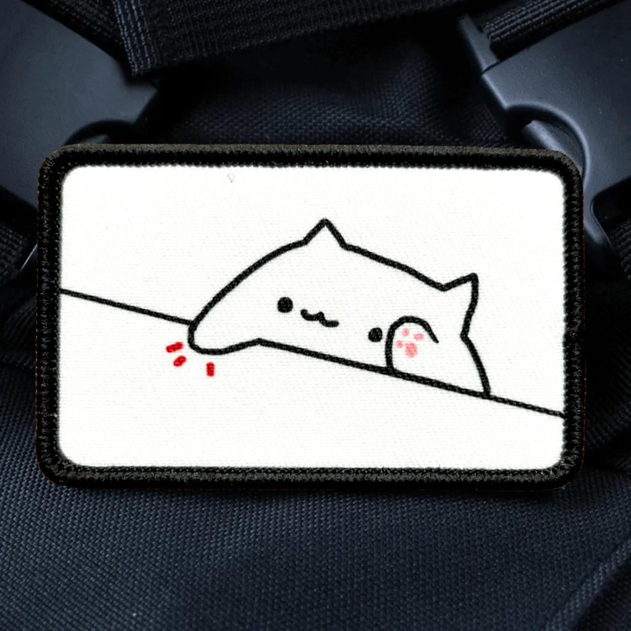 Parche Bongo Fat Cat colocado en mochila táctica