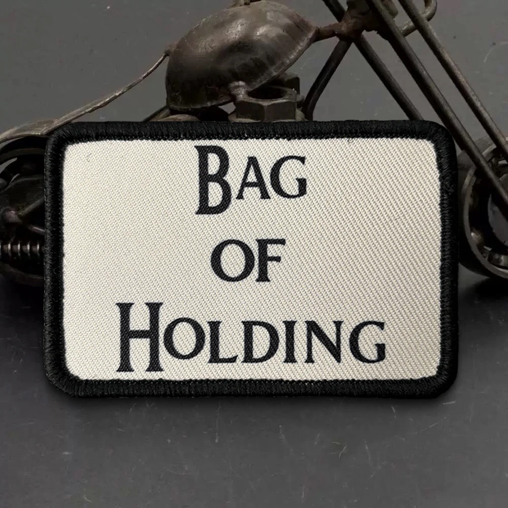 Bolsa con insignia y cierre de tipo gancho y bucle para organizar accesorios
