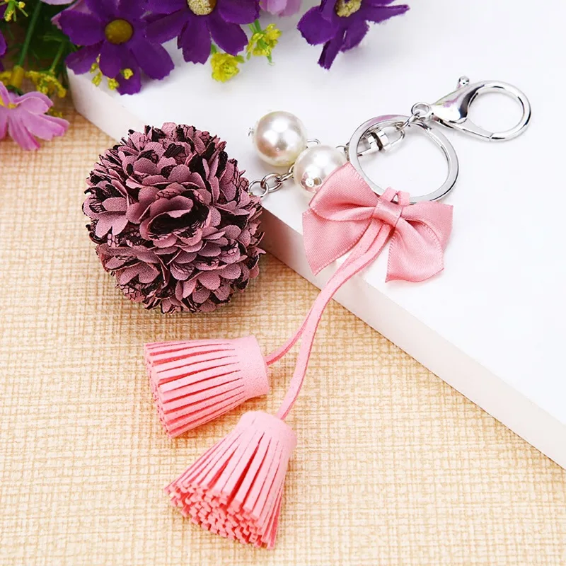 Llavero de Pelo Sintético con pompón y colgante de perlas