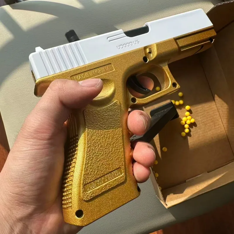 Pistola de juguete efecto oro y plata lanzador de balas blandas