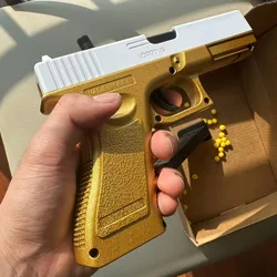 Pistola de juguete efecto oro y plata lanzador de balas blandas
