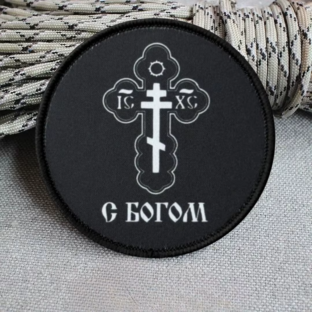 Insignia para brazalete o accesorio textil con velcro
