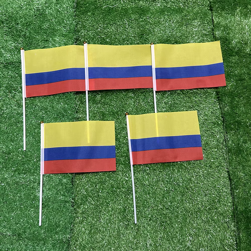 Banderas manuales Colombia 21x14cm con mástil plástico – Deportivo