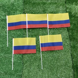 Banderas manuales Colombia 21x14cm con mástil plástico – Deportivo