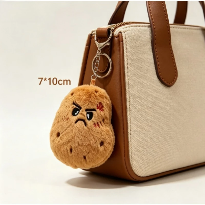 Ojos bordados con expresión divertida del peluche de patata kawaii