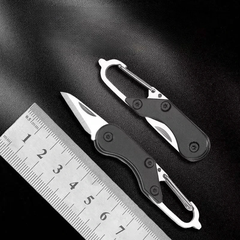 Mini cuchillo plegable de acero inoxidable tipo llavero portátil - imagen 4