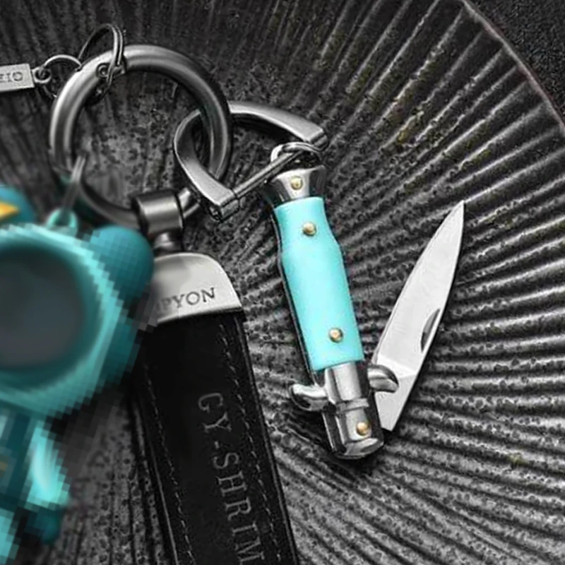 Mini cuchillo de bolsillo plegable tipo llavero multifunción - imagen 4