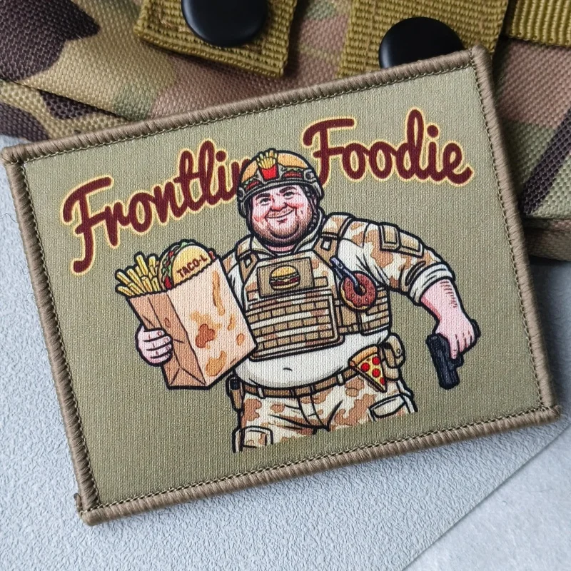 Parche estampado Frontline Foodie en chaleco táctico