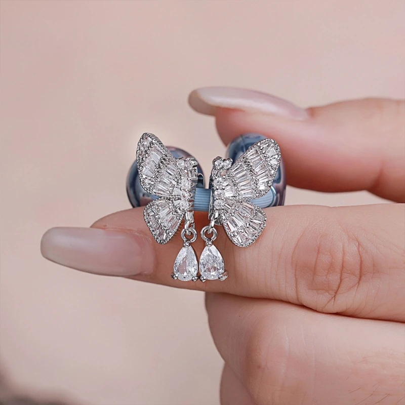 Dijes para auriculares mariposa plateada con cristal y acento gota