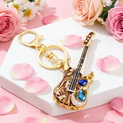 Llavero musical de guitarra con cristales para bolso o coche