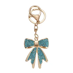 Llavero de cristal dorado con lazo brillante para bolso femenino