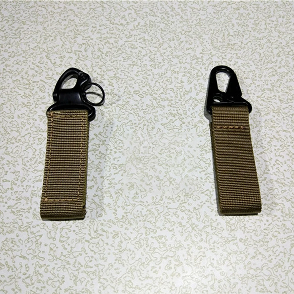 Mosquetón utilizado como hebilla para correas de equipo fotográfico