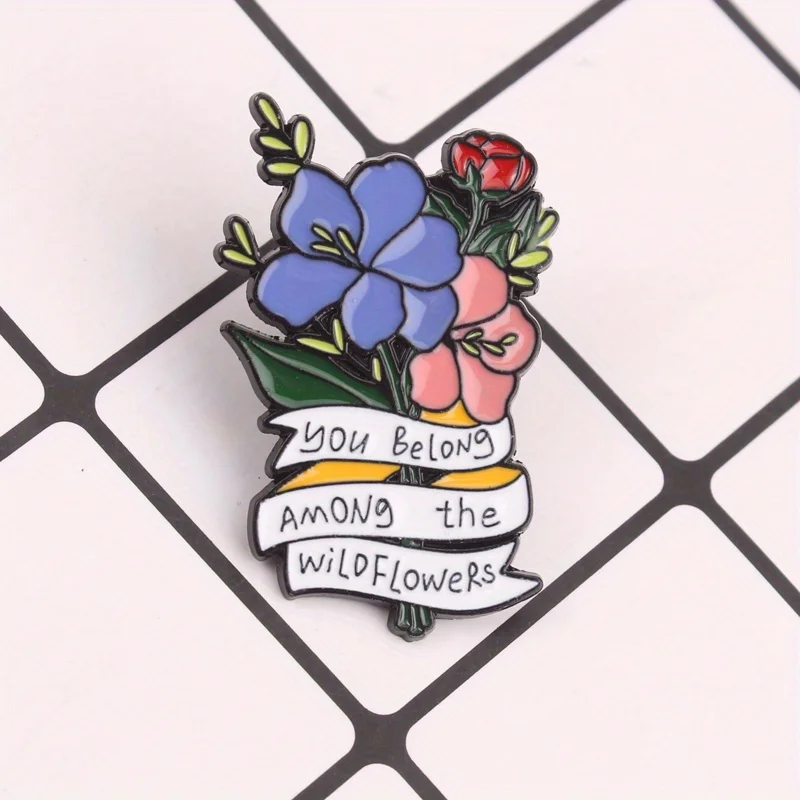 Pin botánico salvaje con diseño floral y tipografía afirmativa