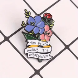 Pin botánico salvaje con diseño floral y tipografía afirmativa